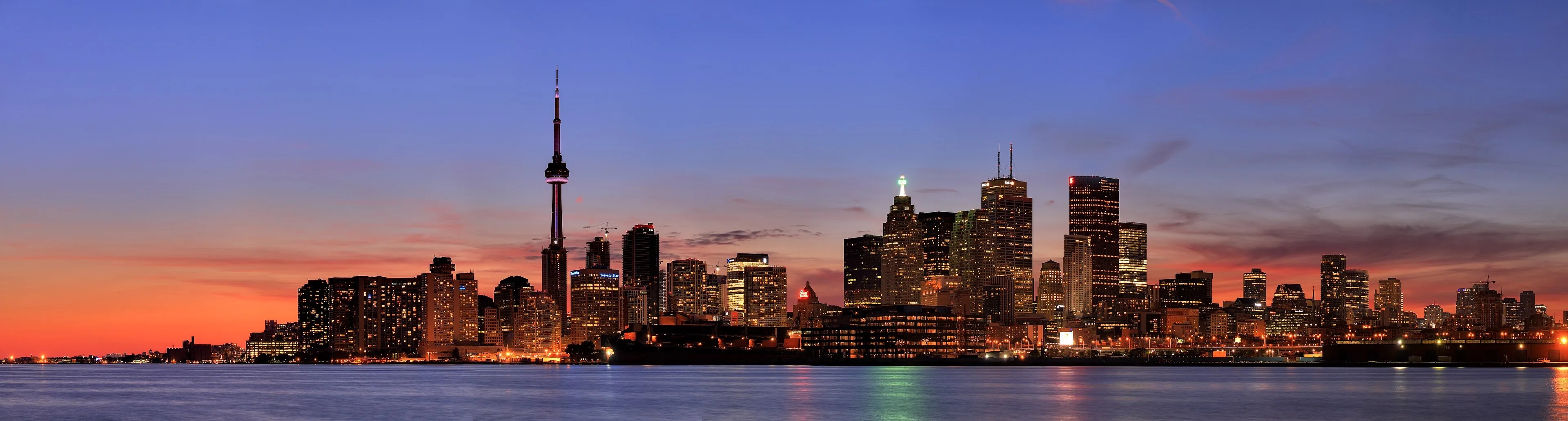 Cheap flights to Toronto: Pearson vs Billy Bishop, the UP Express, and when to book The Toronto skyline with the CN Tower at dusk