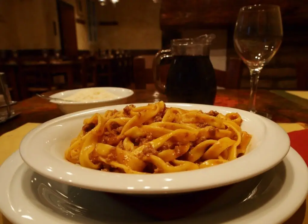 A plate of tagliatelle al ragù in a Bologna trattoria