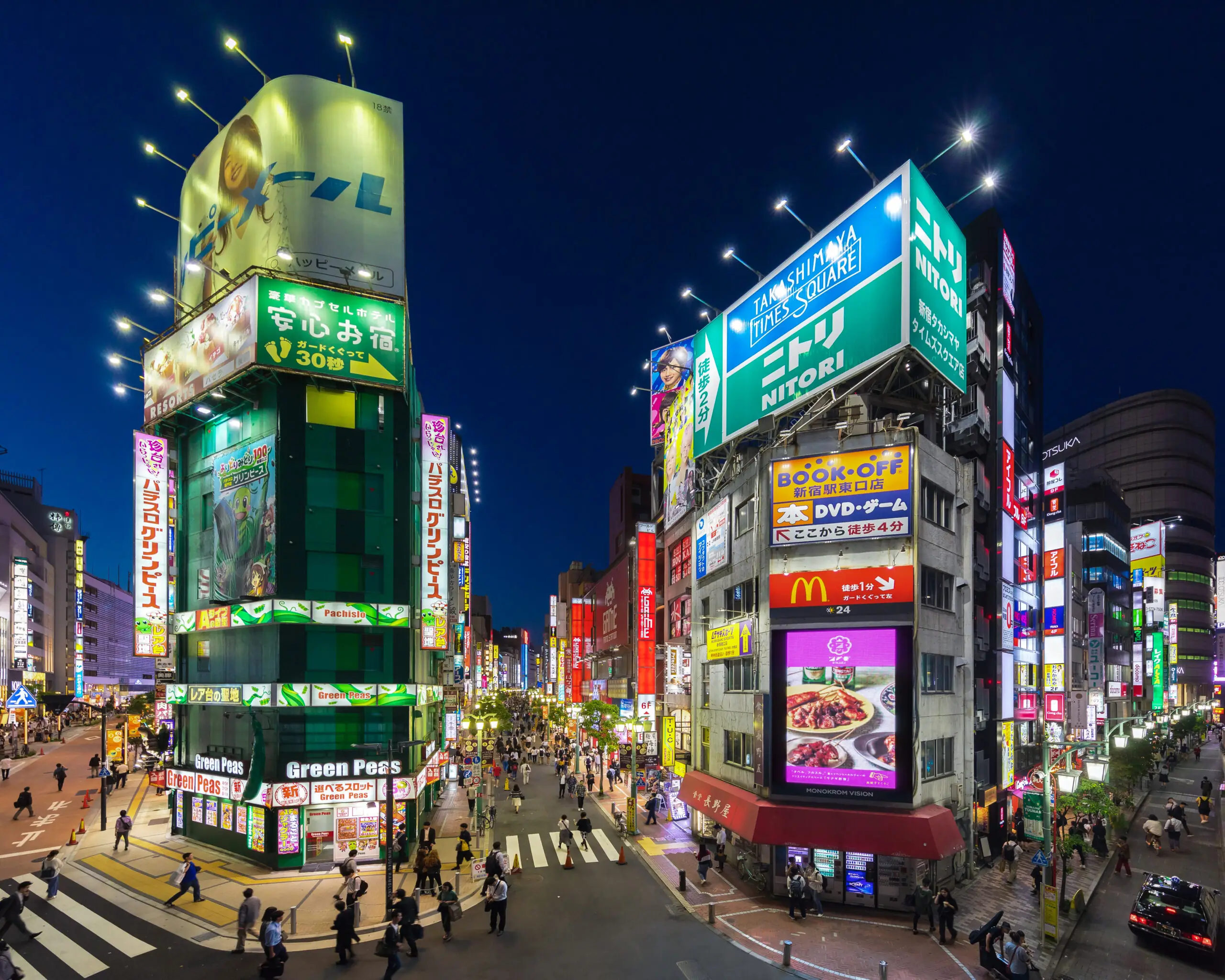 Neon-lit street scene in Shinjuku, Tokyo at night