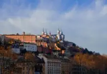 Vieux Lyon below the Fourvière basilica under a blue sky