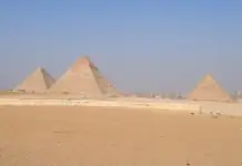 The pyramids of Giza with Cairo in the distance