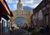 The Reality of Antigua Guatemala: The Capital the Earthquakes Took Santa Catalina arch with Volcán de Agua behind, Antigua Guatemala