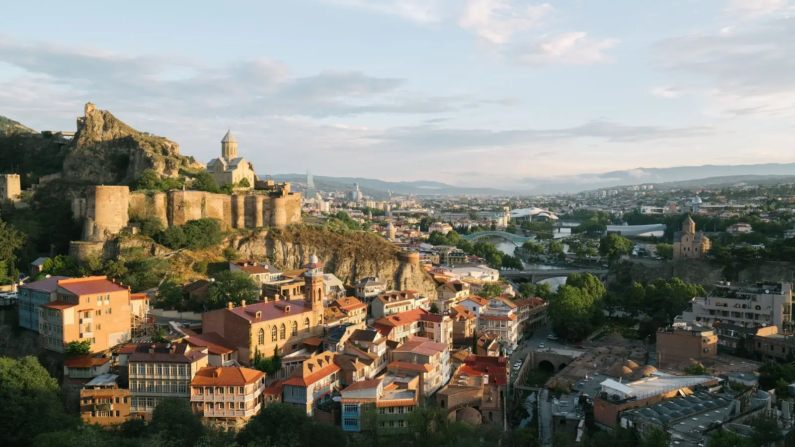 Narikala fortress above the balconied Old Town of Tbilisi at first light