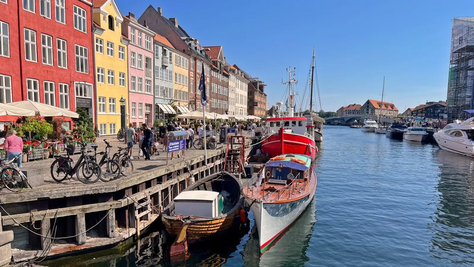 Colorful townhouses and boats along the Nyhavn canal in Copenhagen