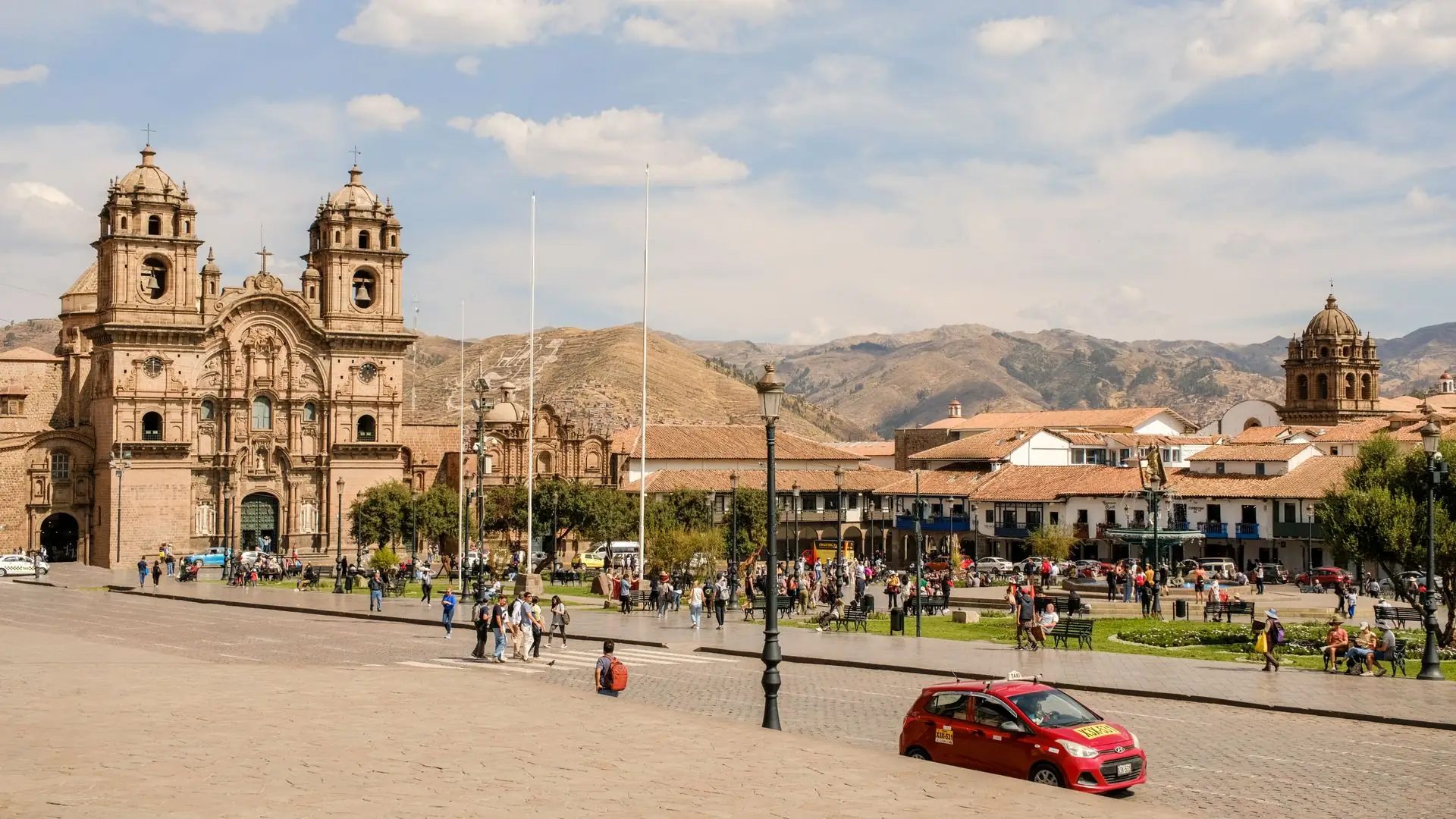 The Plaza de Armas in Cusco with its baroque churches and the Andes behind