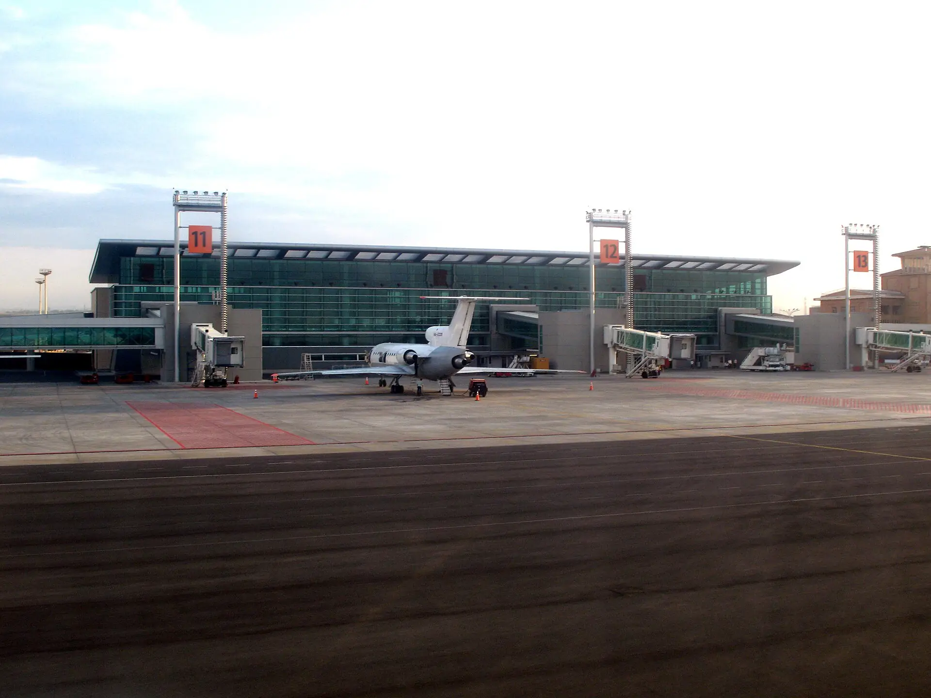 Zvartnots International Airport terminal seen from the apron with jet bridges