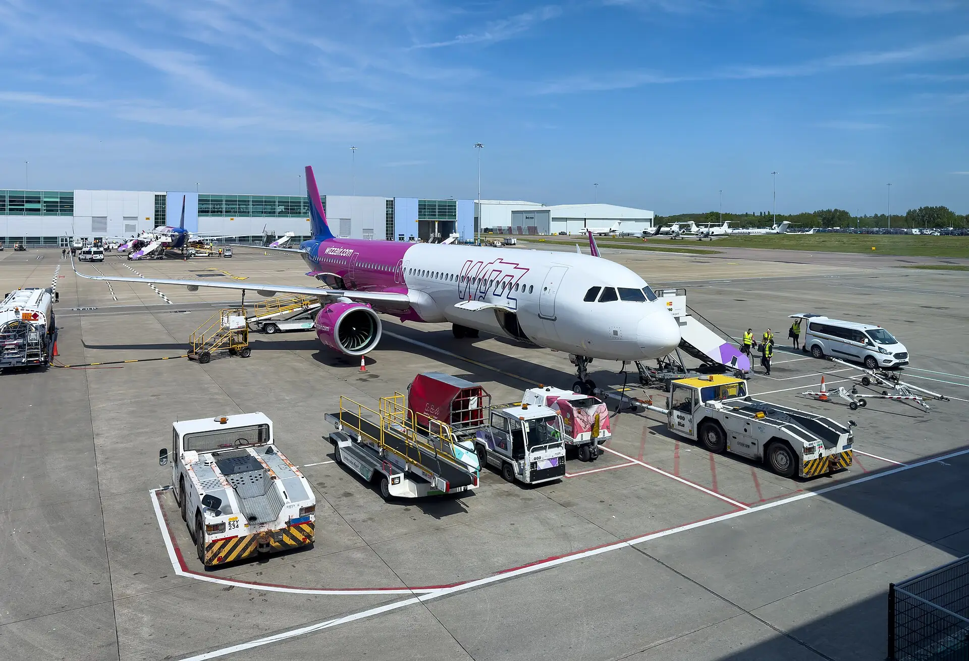Wizz Air Airbus A321neo parked at an airport stand