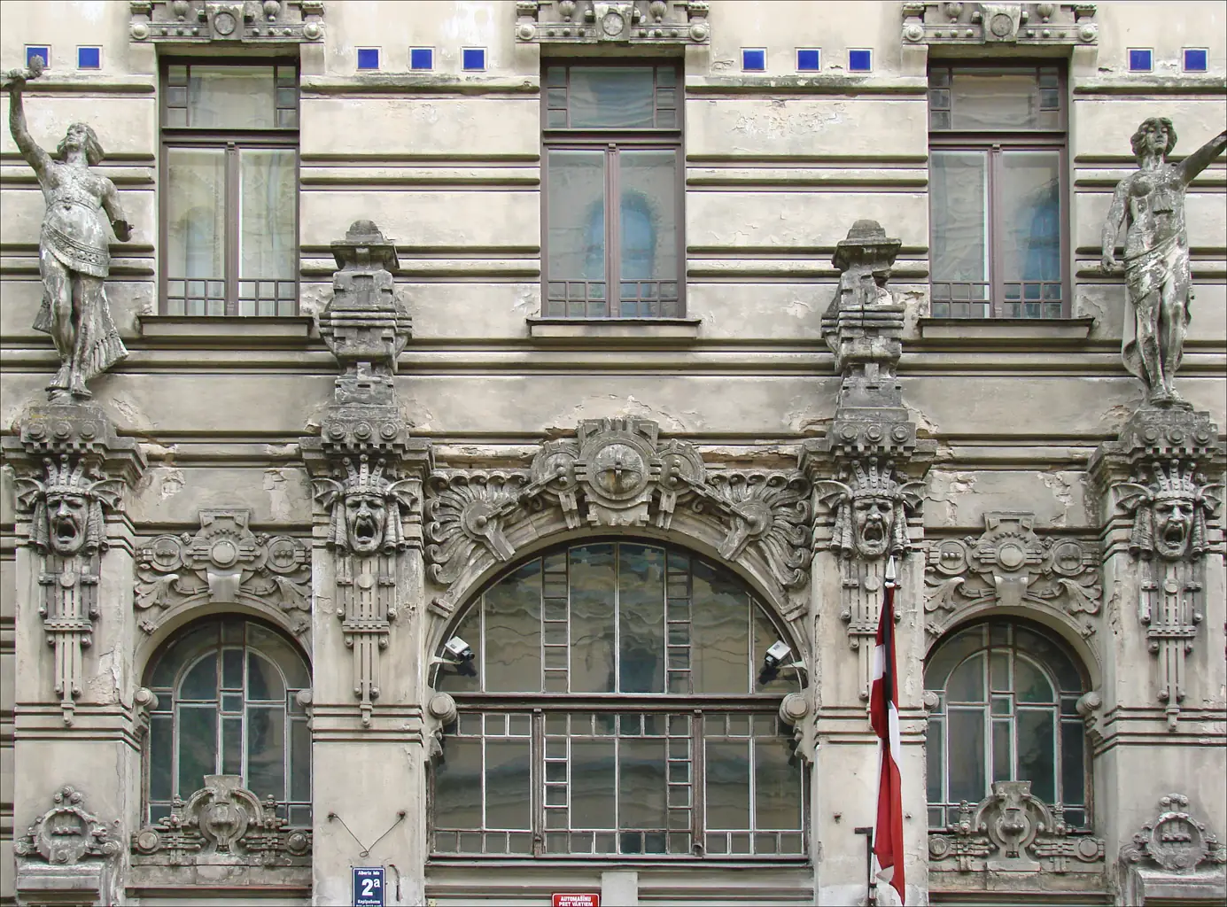 Art Nouveau facade at Alberta iela 2a in Riga with sculpted faces and statues