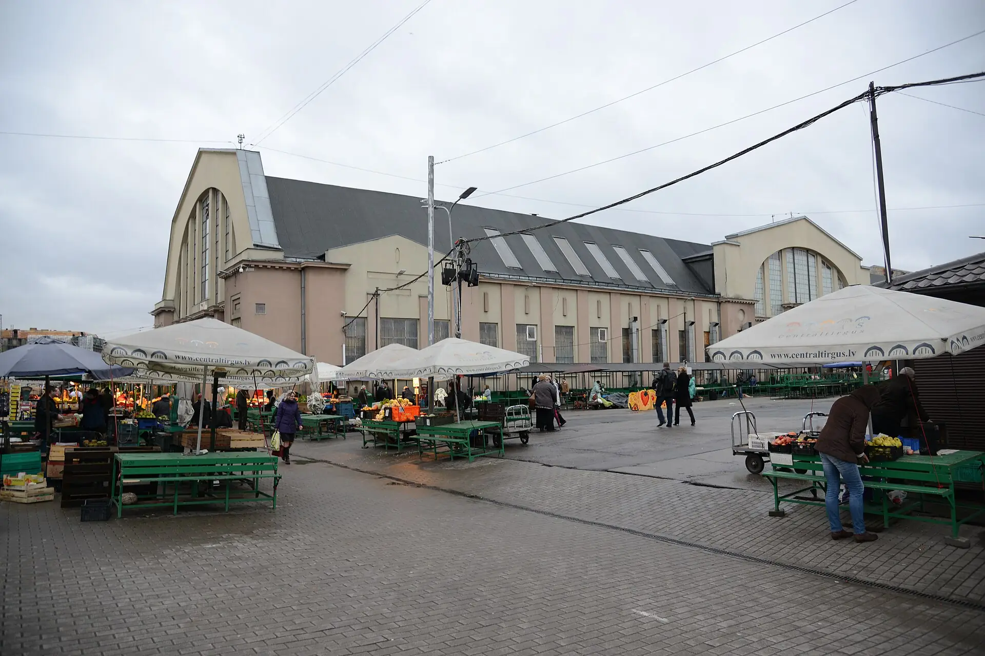 Arched pavilion of Riga Central Market with stalls outside