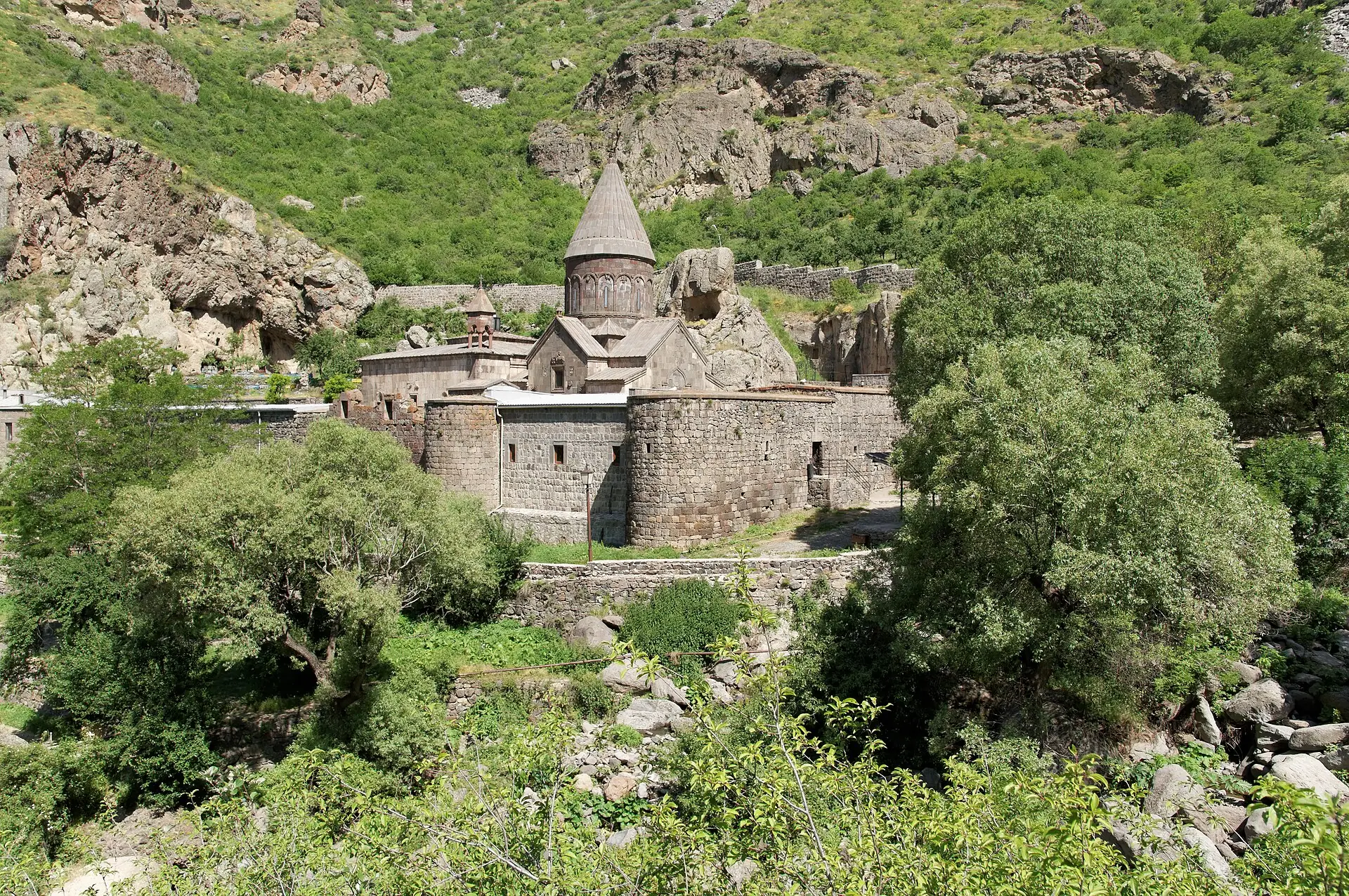 Geghard monastery with its conical dome set against the cliffs of the Azat valley