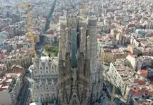 Aerial view of the Sagrada Familia rising over the Eixample grid in Barcelona