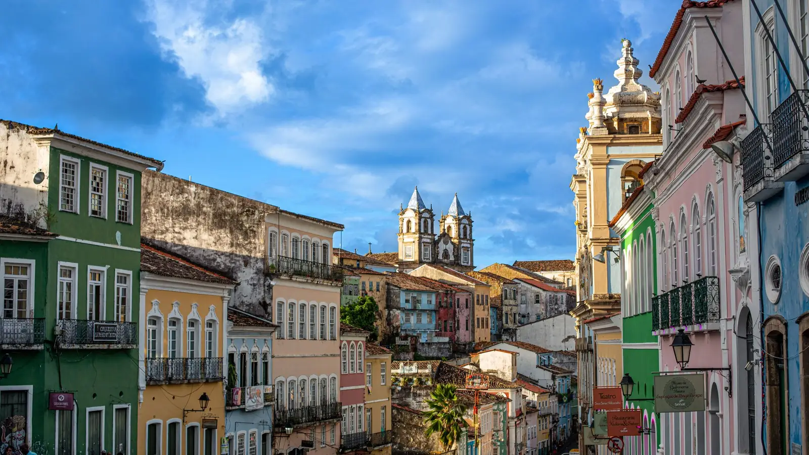 Colourful colonial facades and church towers of Pelourinho in Salvador under a blue sky
