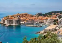 Cheap flights to Dubrovnik: the airport behind the mountain, the city with no railway, and the season that switches the map off Dubrovnik Old Town walls and harbor on the Adriatic
