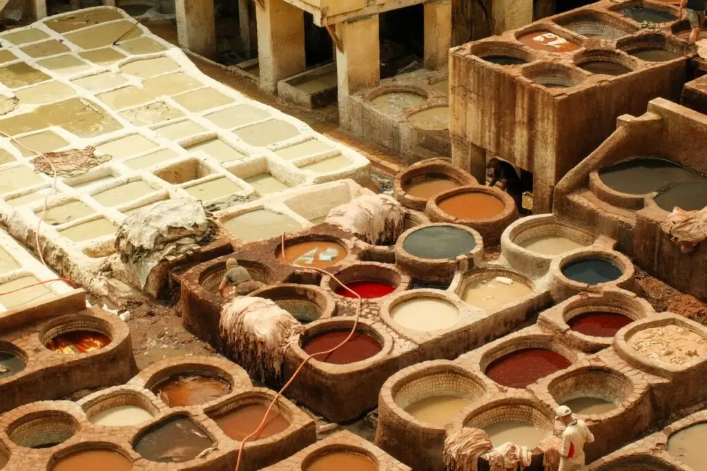 Stone dye pits of the Chouara tannery in Fez seen from a terrace above