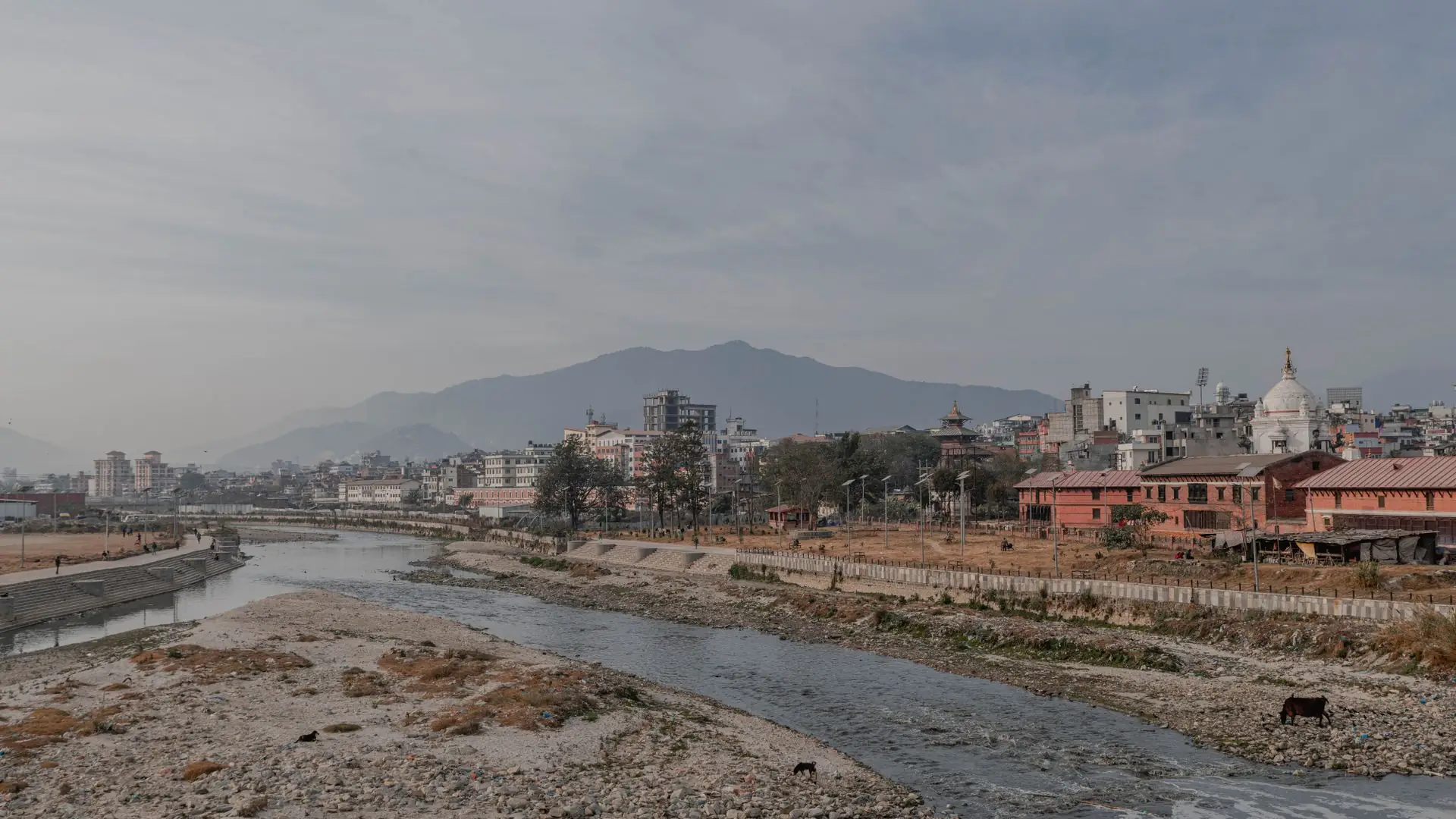 Kathmandu river valley with stupa and mountains beyond
