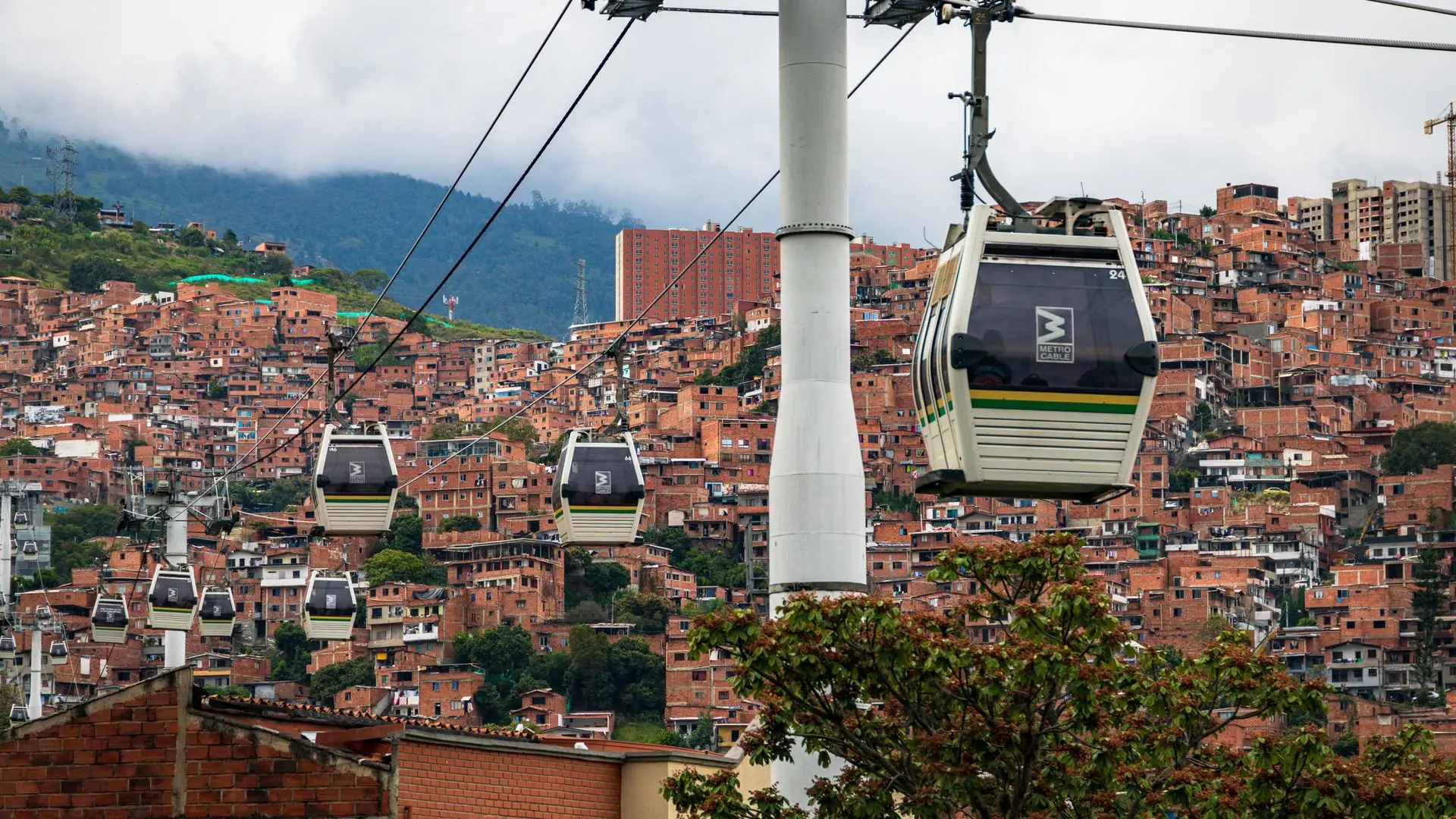 Metrocable cable cars over Medellín hillside neighborhoods