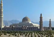 Cheap flights to Muscat: the calm Gulf connection, the stopover you can actually book, and the taxi advice that quietly expired Sultan Qaboos Grand Mosque dome and minarets in Muscat
