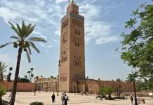 Cheap flights to Marrakesh: the low-cost boom into RAK, the airport six kilometres from the square, and the summer the fares invert Koutoubia mosque minaret rising over the square in Marrakesh on a bright day