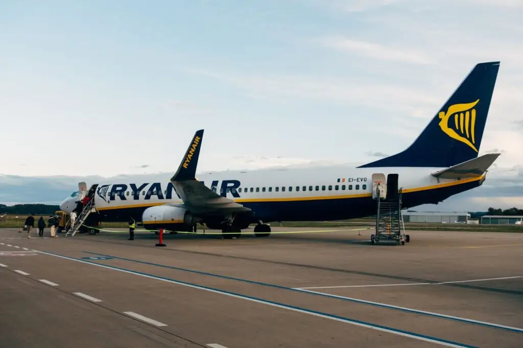 A Ryanair Boeing 737 boarding passengers by stairs on the tarmac