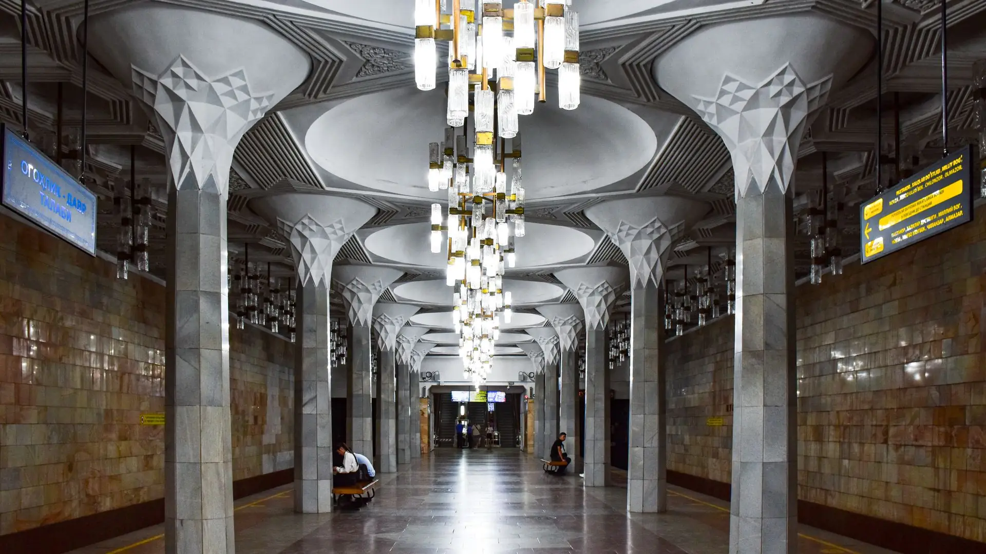 Ornate columns and chandeliers in a Tashkent metro station
