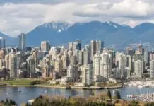 Cheap flights to Vancouver: the train inside the terminal, the surcharge that only runs one way, and the eTA to buy before the ticket Vancouver skyline with marina and North Shore mountains